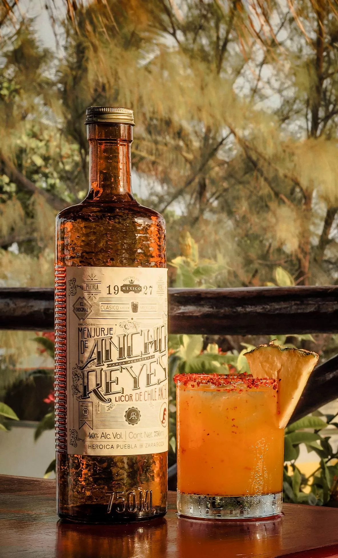 Ancho Reyes Mezcal bottle and a refreshing passion fruit drink called the "Reyes del Puerto" served at La Sirena.