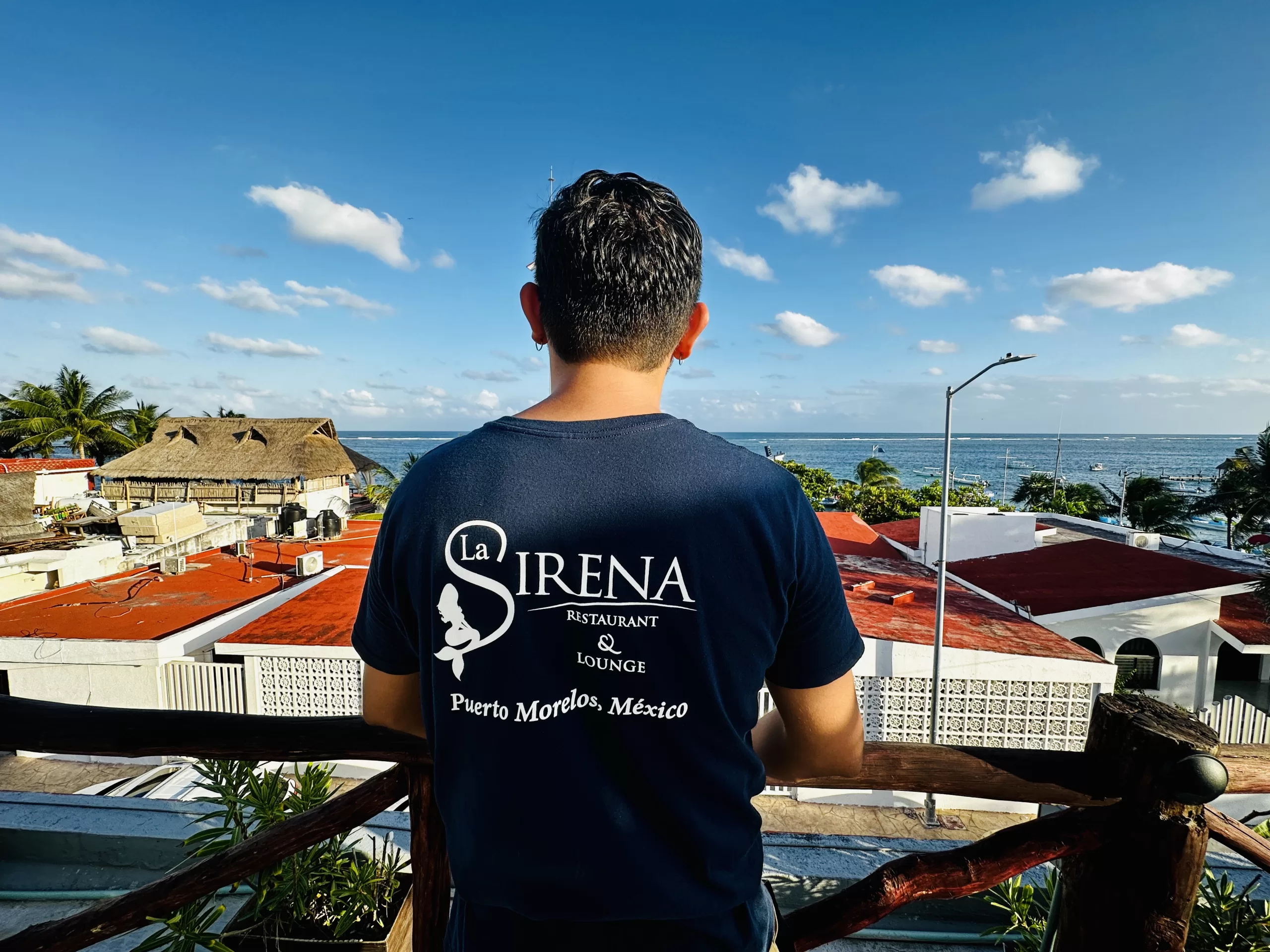 La Sirena employee enjoying ocean view.
