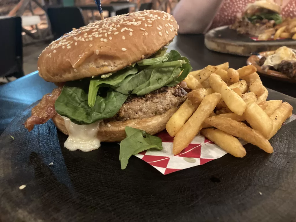 Mexican burger with cheese, bacon, and guacamole at La Choza del Puerto.