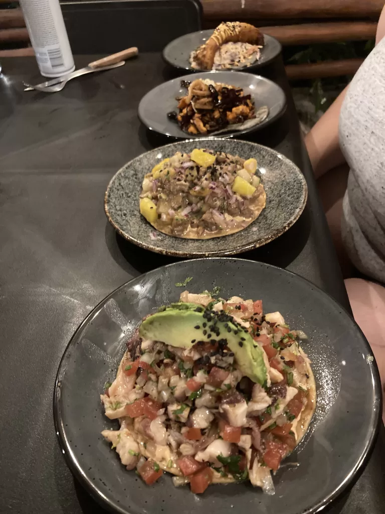 Assortment of seafood tostadas and a fish taco at La Choza del Puerto.