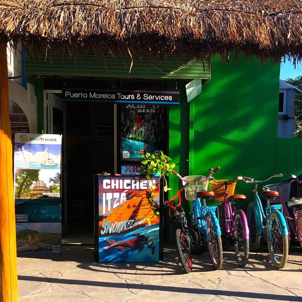 Image of the Puerto Morelos Tours booth with bike rental.