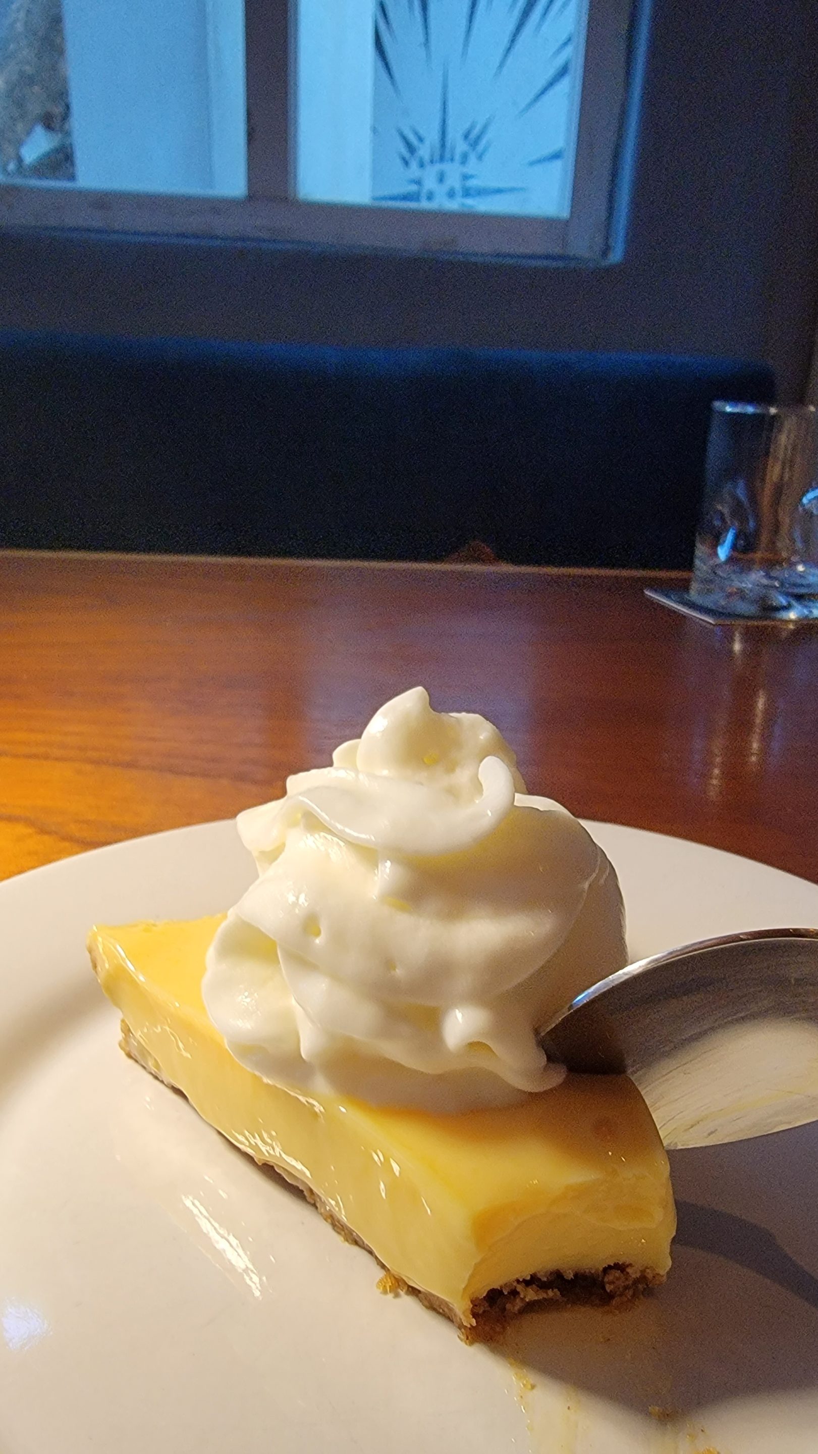 John Grays Kitchen in Puerto Morelos offers a delicious, creamy lemon pie dessert topped with whipped cream.